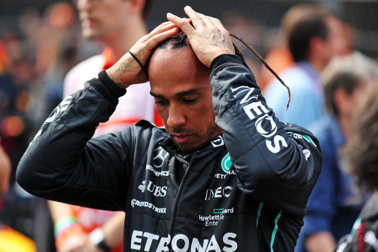 Lewis Hamilton holding his head