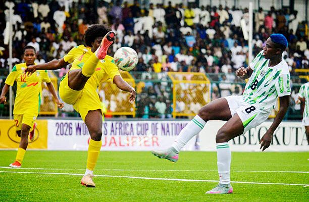 Benin player, Nailotou Olabisi Sadikou, retrieves ball from Nigeria's Asisat Oshoala in 2026 WAFCON Qualifier