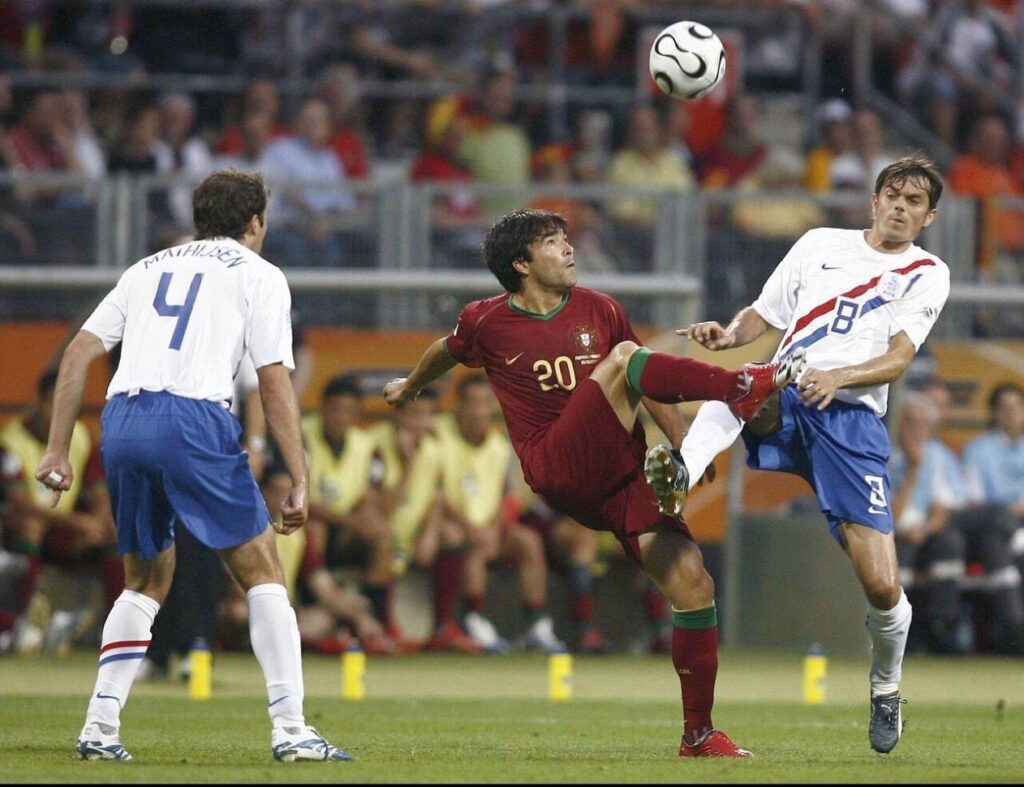 Deco raising his boots very high while contesting the ball against a Dutch player during the 2006 World Cup round of 16 match.