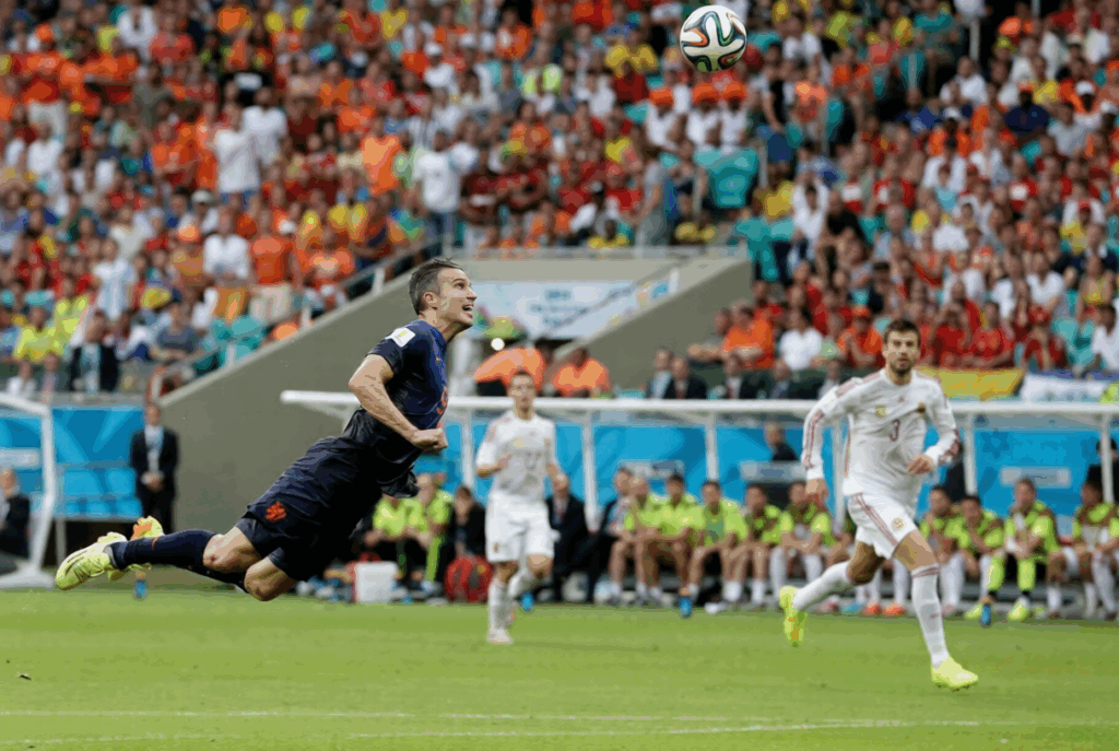 Robin Van Persie scores a flying header against Spain in the group stage match of the 2014 World Cup