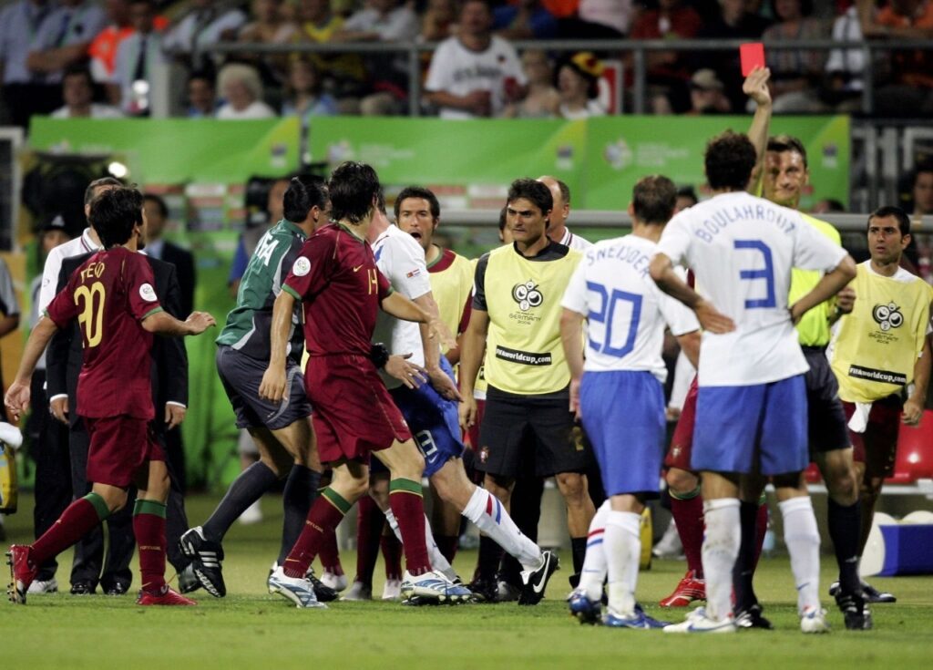  Khalid Boulahrouz  of the Netherlands, is shown the red card by Referee Valentin Ivanov of Russia, after appearing to elbow Luis Figo of Portugal in the face during the FIFA World Cup Germany 2006 Round of 16
