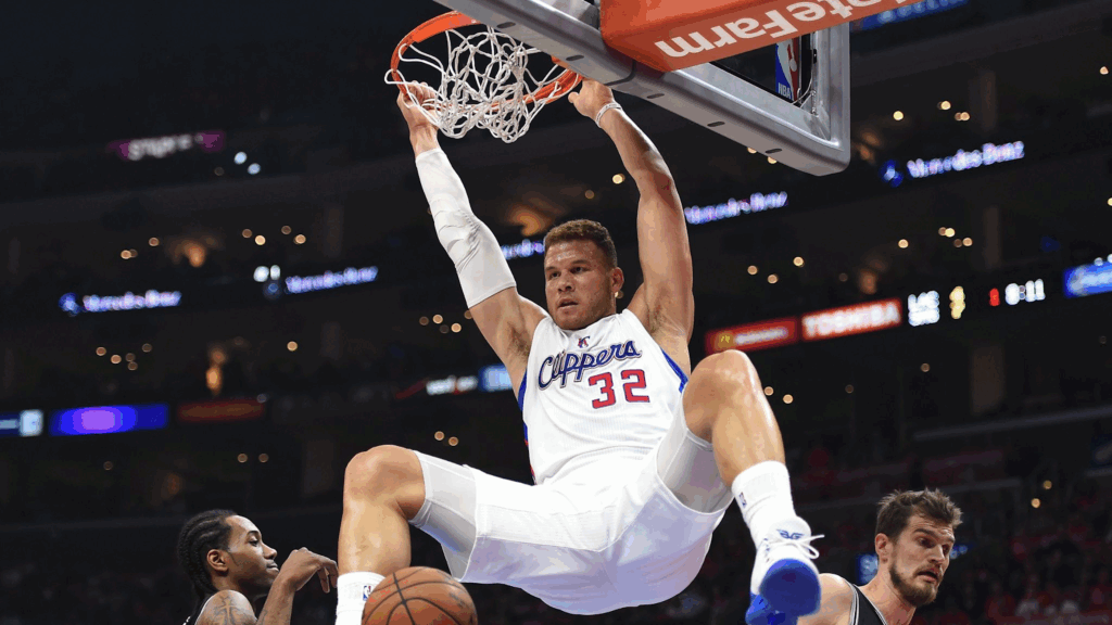 Blake Griffin hangs on to the rim after a dunk