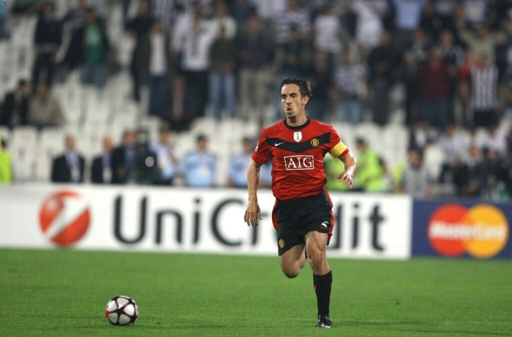 Gary Neville on the ball in Manchester United colours