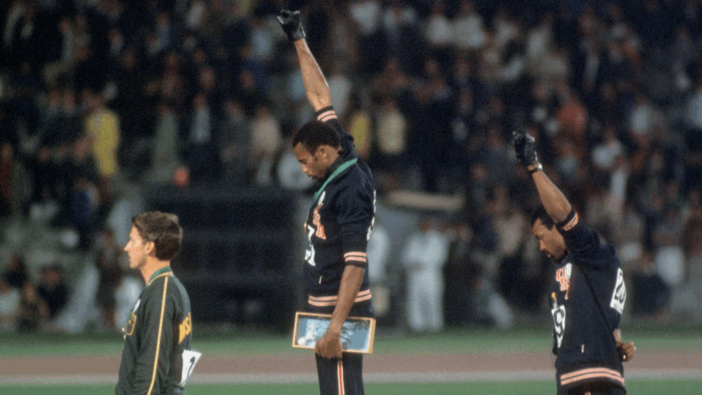 Tommie Smith and John Carlos carry out the Black Power salute at the 1968 Mexico Olympics.