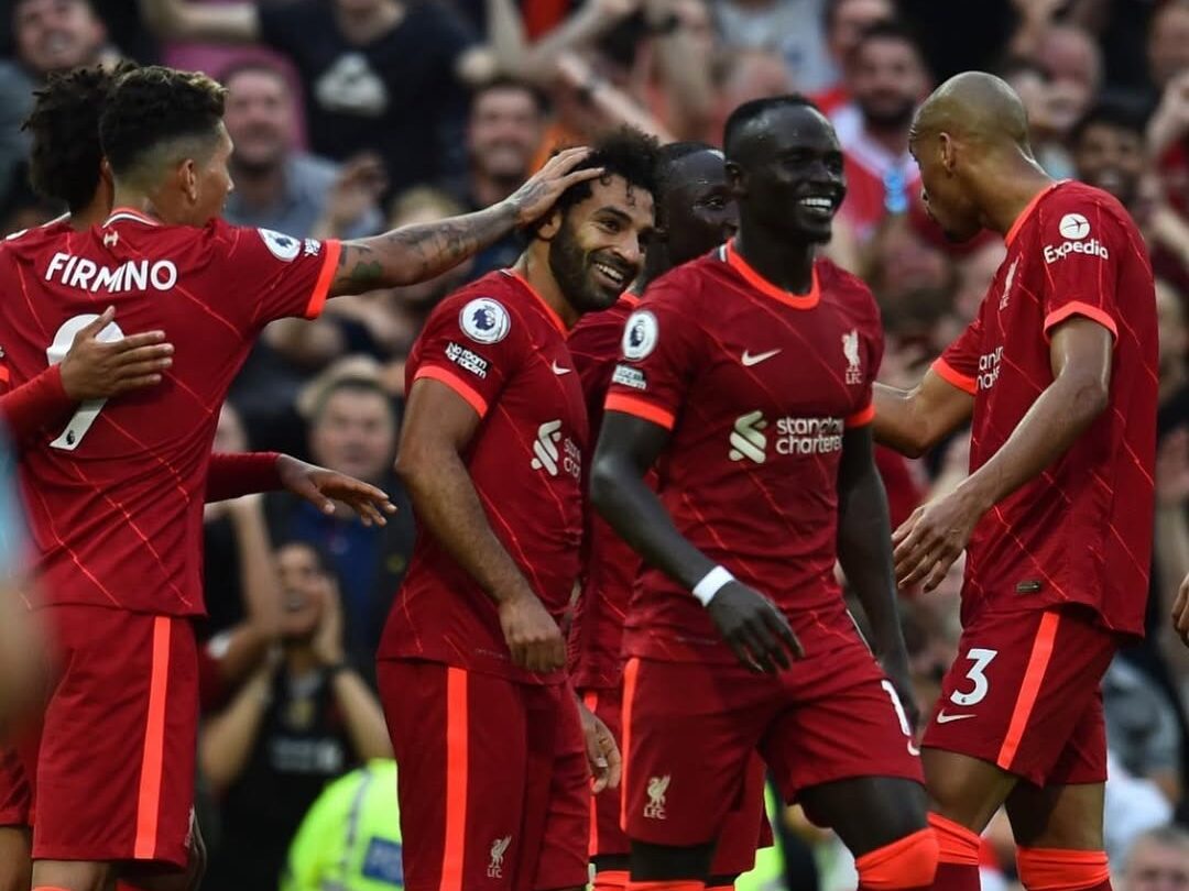 Salah and Mane celebrating with their Liverpool teammates