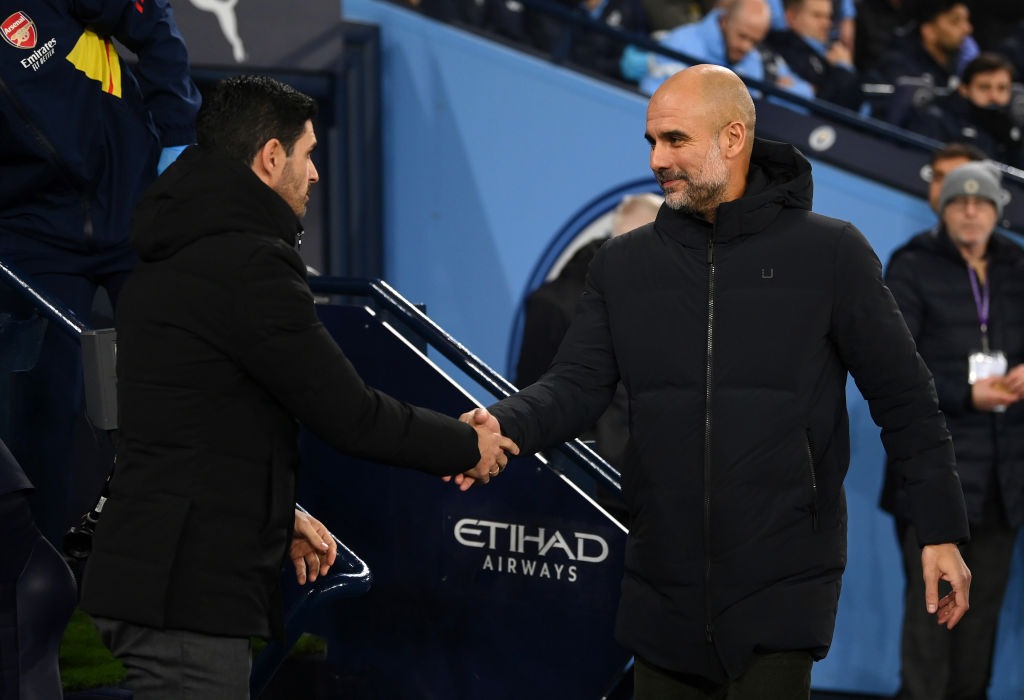 Pep Guardiola exchanges a handshake with Mikel Arteta after a match