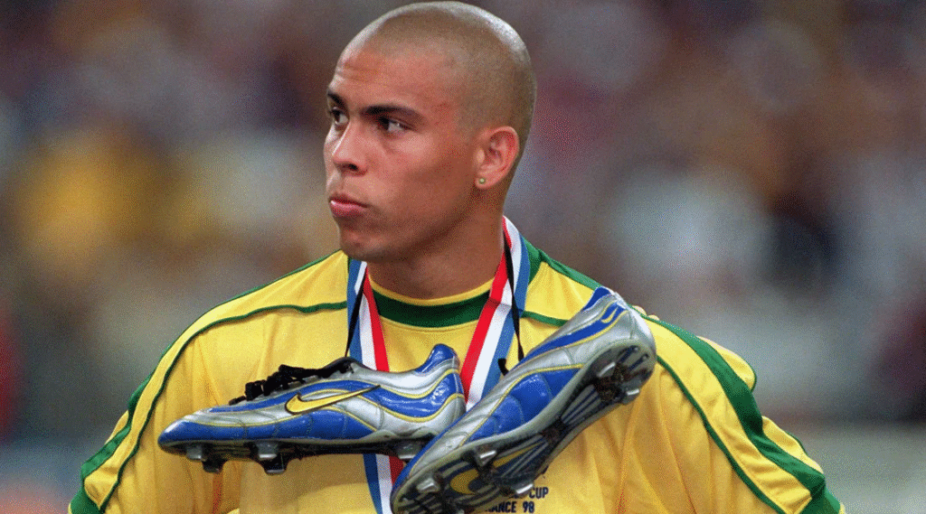Ronaldo looking disappointed with his boots around his neck after Brazil lost to France in 1998 World Cup final
