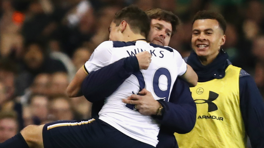 Winks hugging Pochettino