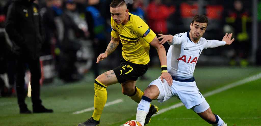 Winks attempts a tackle during a game against Dortmund