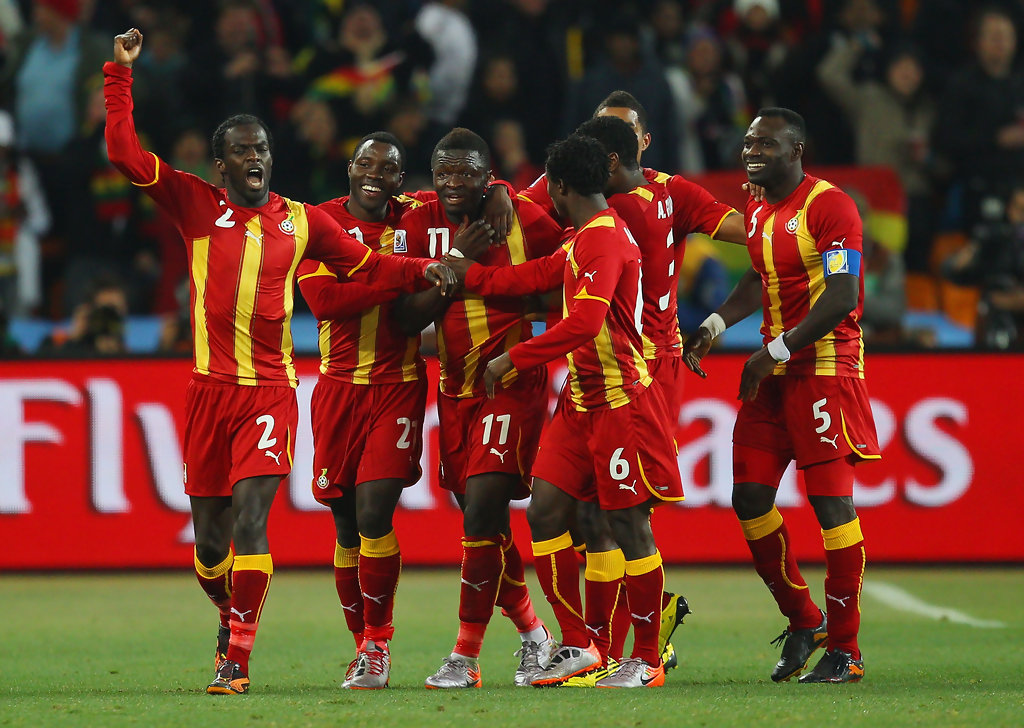 Sulley Muntari celebrates his goal against Uruguay with his teammates at the 2010 FIFA World Cup.
