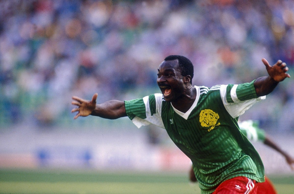 Roger Milla wheels away in jubilation after scoring the winning goal against Columbia at the 1990 FIFA World Cup.