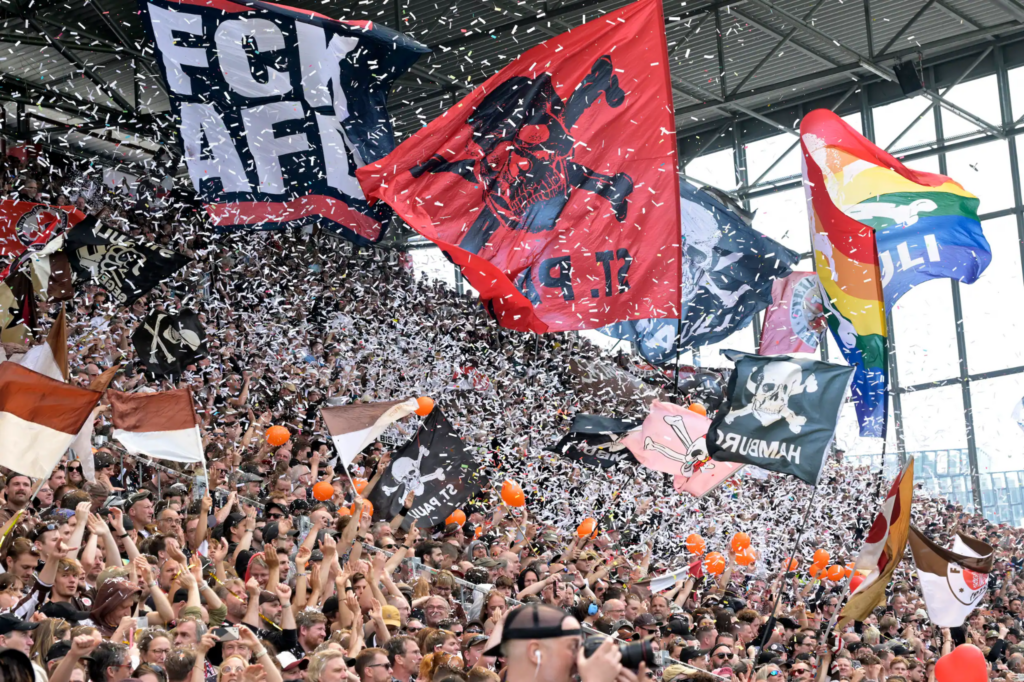 St. Pauli fans waving different flag during a match