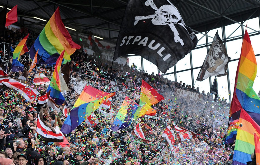 St. Pauli fans wave LGBTQ+ flag during a match