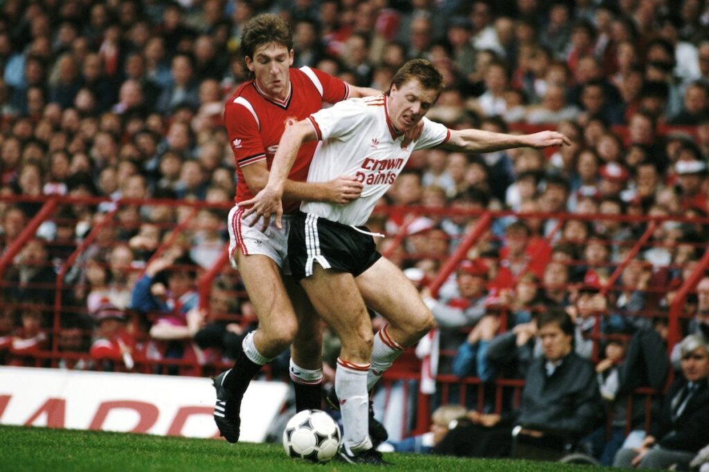 Norman Whiteside in a tussle with his opponent