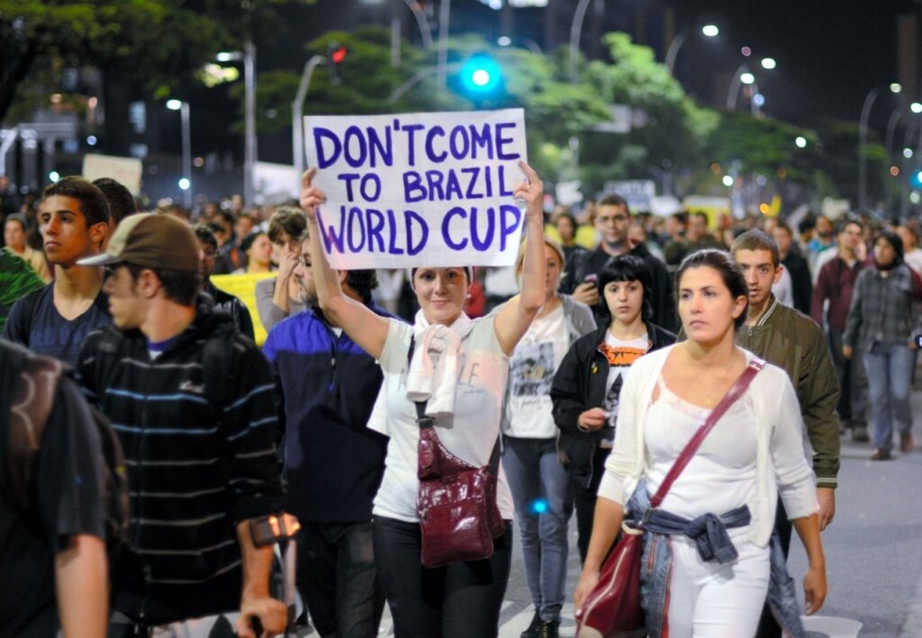 Brazilians protesting the demolition of their houses to accommodate stadium infrastructure in 2014
