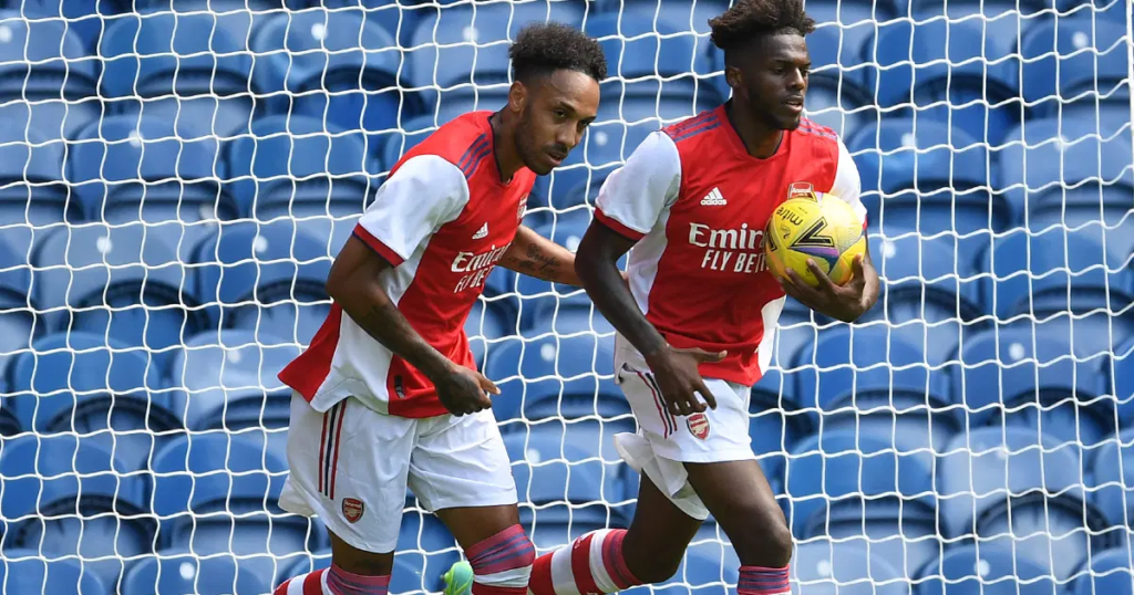 Aubameyang celebrating with Arsenal teammate after scoring a goal