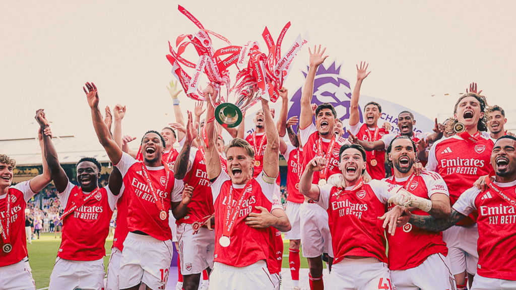 Arsenal players lifting the Premier League trophy in 2026