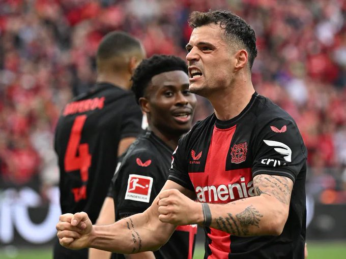Nathan Tella and Xhaka celebrating a goal 