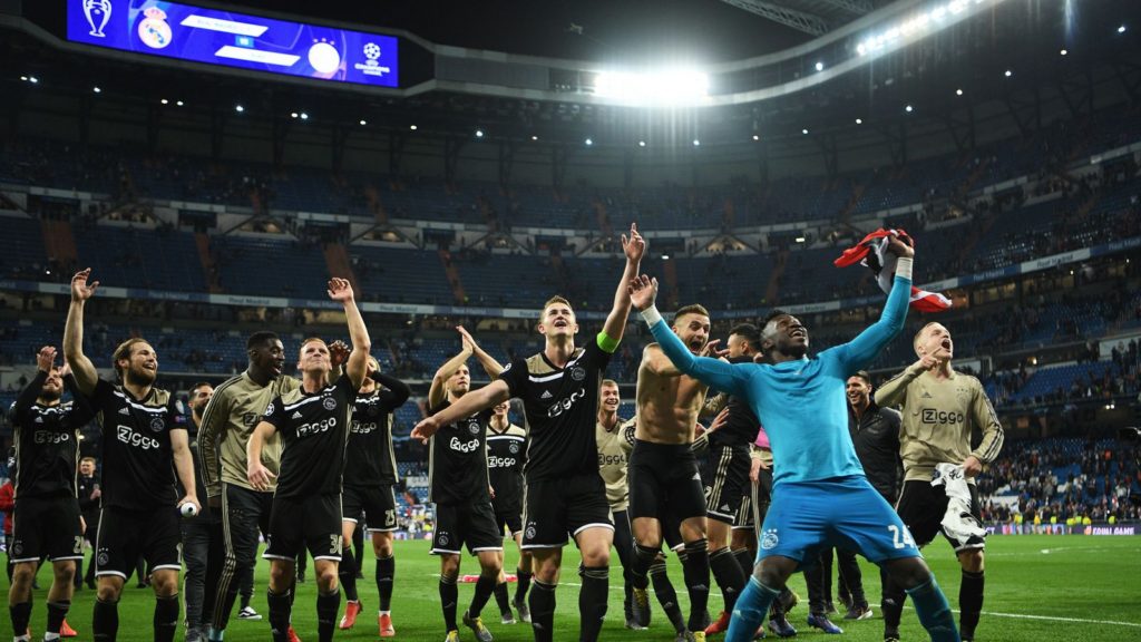 Ajax players celebrate their 4-1 win over Real Madrid at the Bernabéu