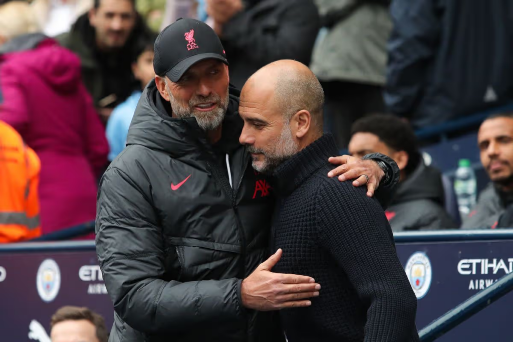 Jürgen Klopp and Pep Guardiola embrace ahead of their penultimate Premier League clash