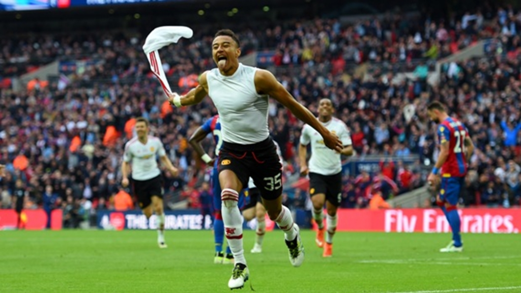 Jesse Lingard in a wild celebration after scoring a stoppage time goal to win United an FA Cup
