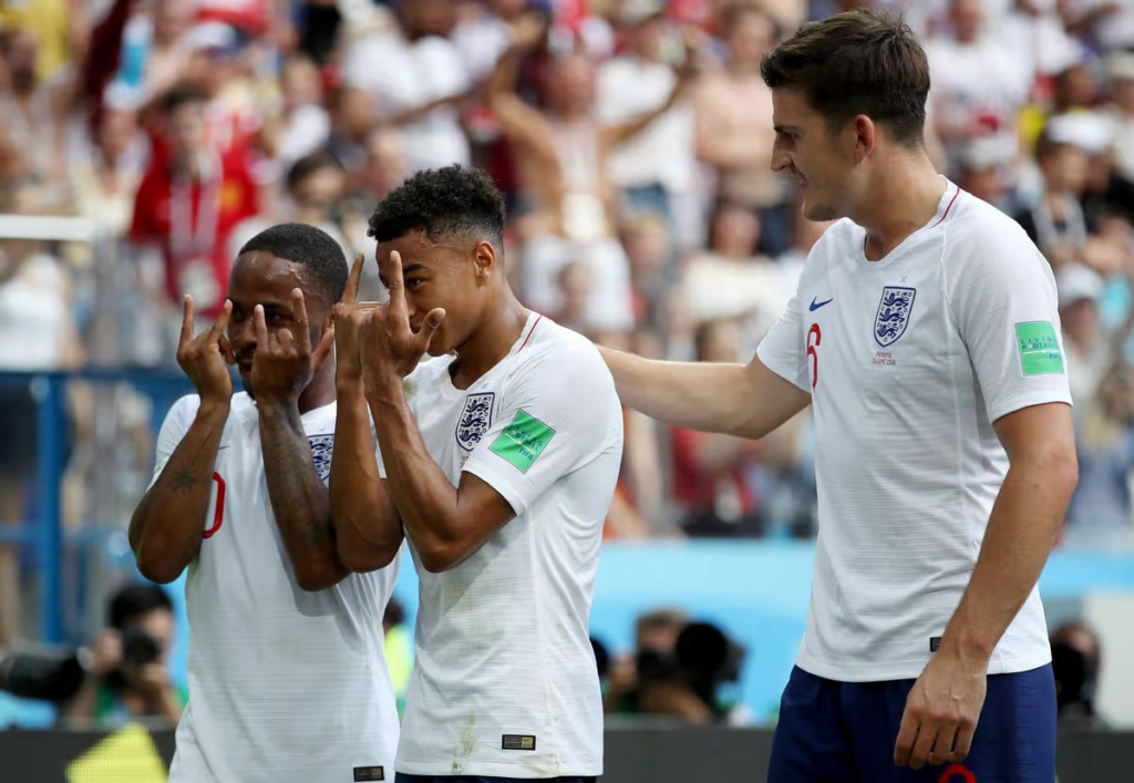 Sterling and Maguire joining Lingard to celebrate a goal for England during the 2018 World Cup in Russia