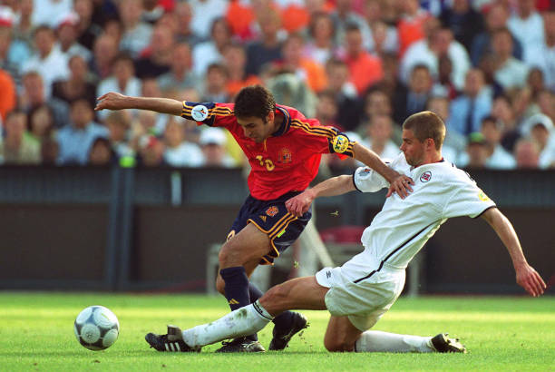 Raul of Spain and Bjorn Otto Bragstad of Norway challenge during the UEFA Euro 2000 Group C match between Spain and Norway 
