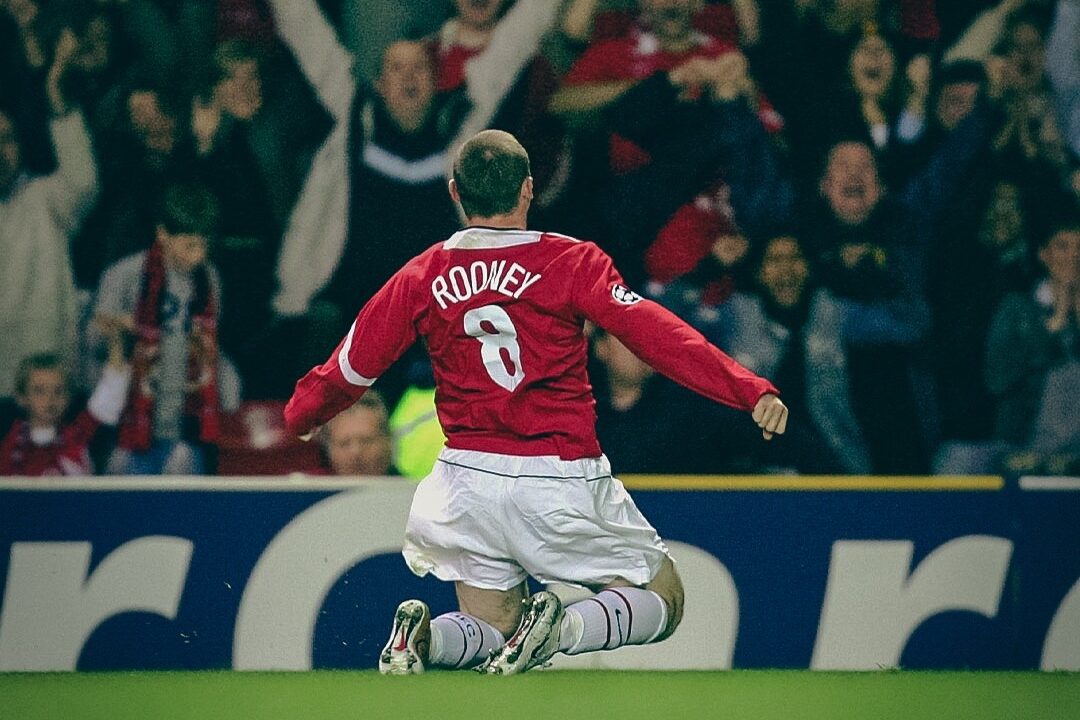 Wayne Rooney doing the knee-slide celebration 